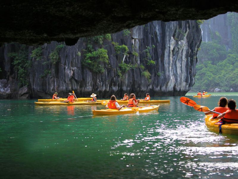 Tourists explore mysterious caves in Halong Bay
